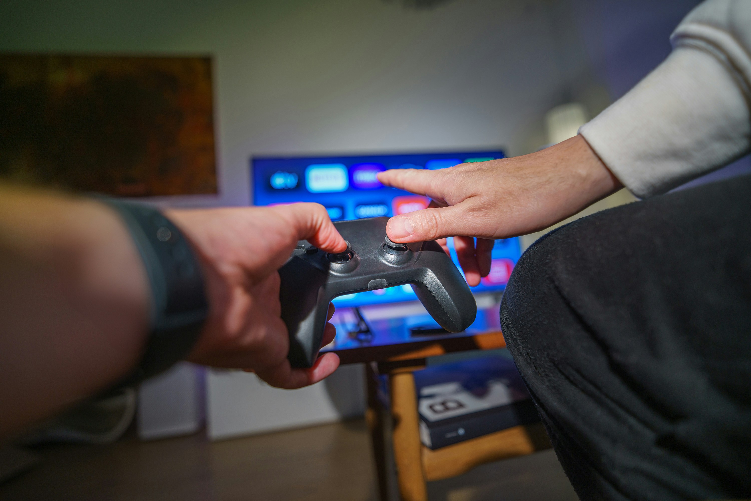 Friends sharing a console gaming session